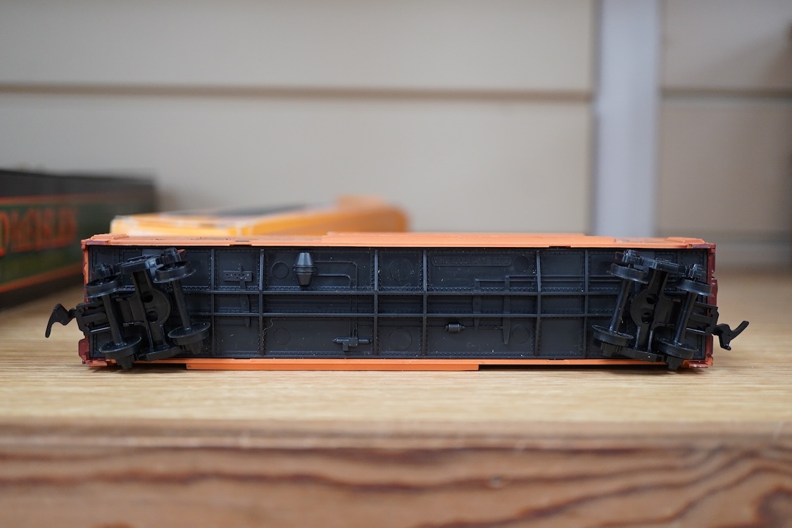 A quantity of US outline HO railway by Athearn, Bachmann, etc. including three locomotives; a Union Pacific Bo-Bo diesel, 1468, a Santa Fe Bo-Bo diesel, 5707, and a Santa Fe 0-4-0 tender engine, together with a 12-wheel